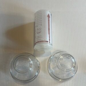 The Pampered Chef set of 2 Clear Glass Mixing Bowls with plastic Measurement Cup